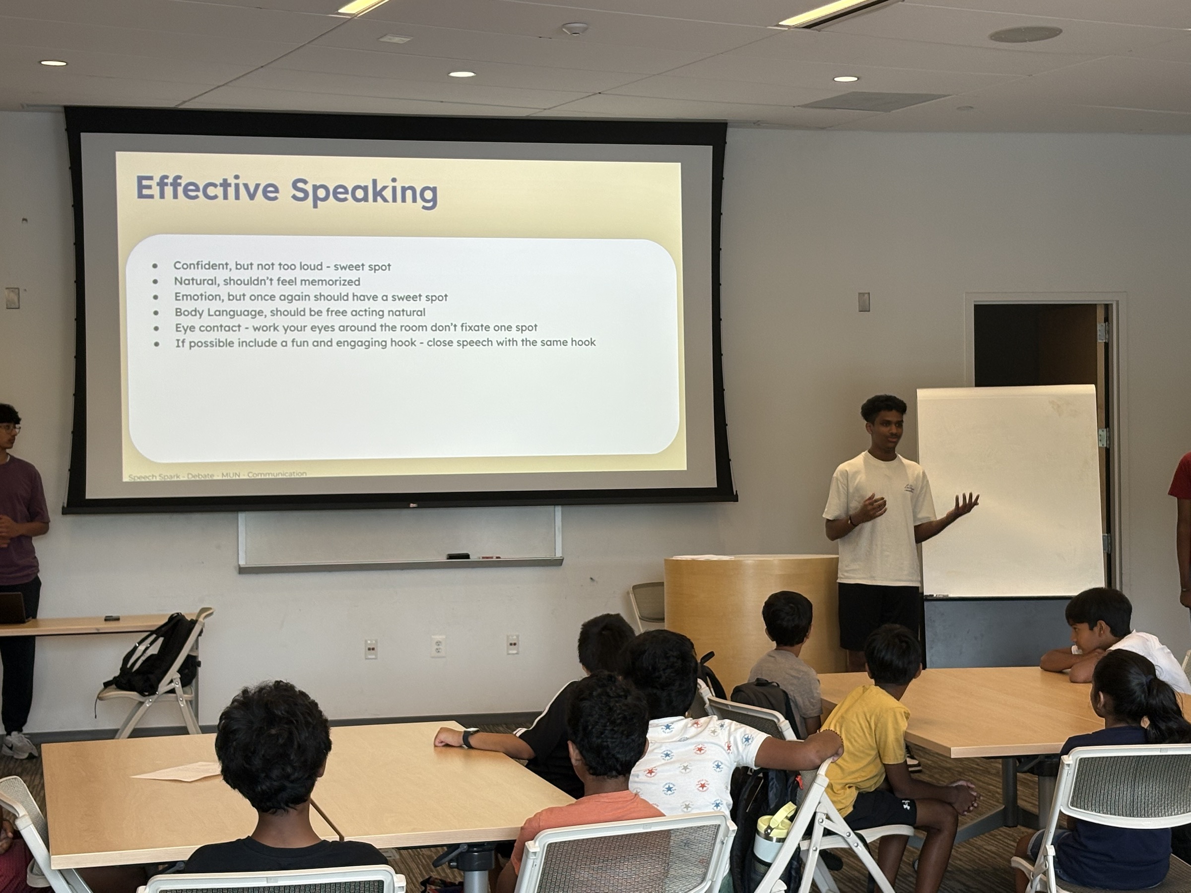 A volunteer instructor helping students