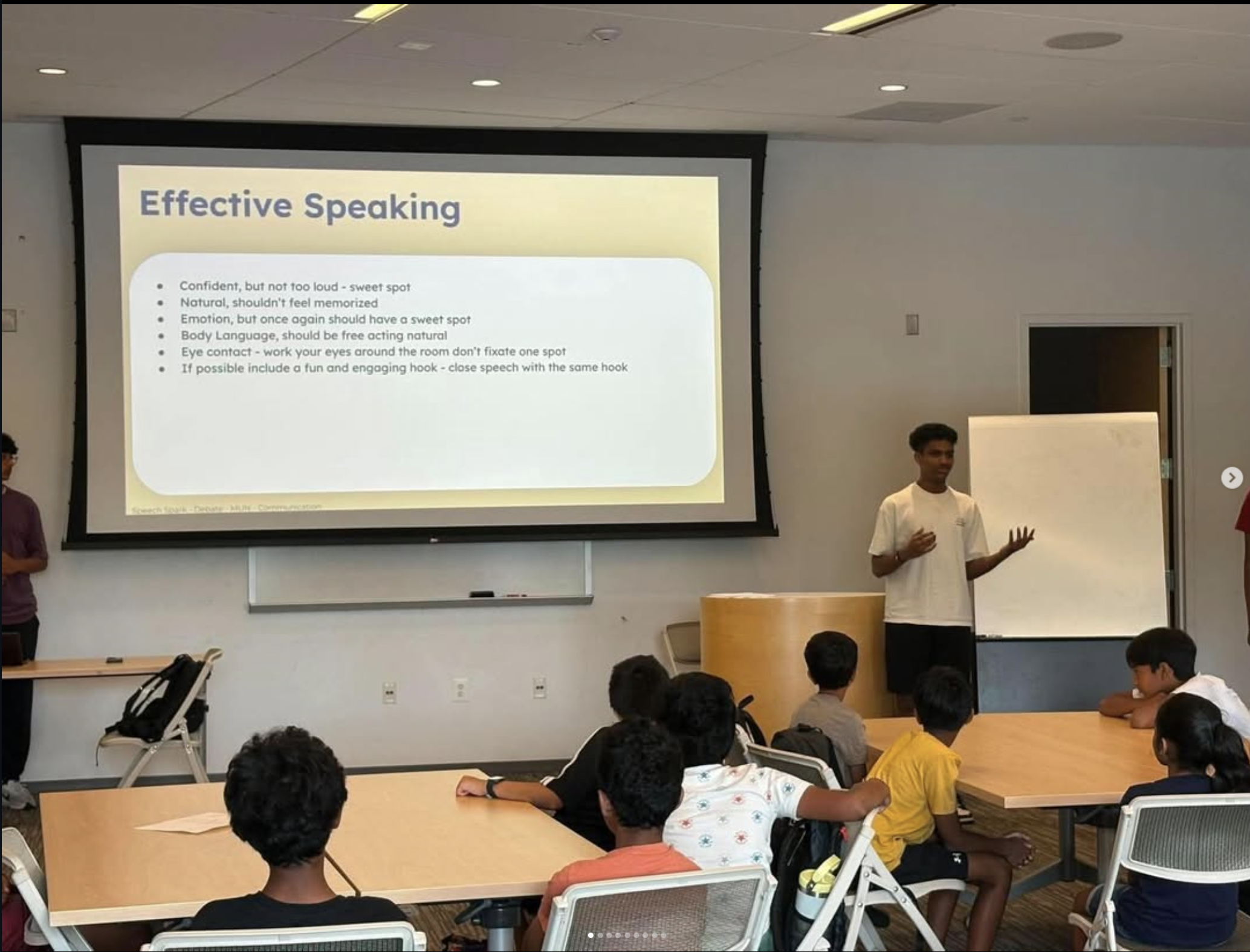 A student instructor guiding students