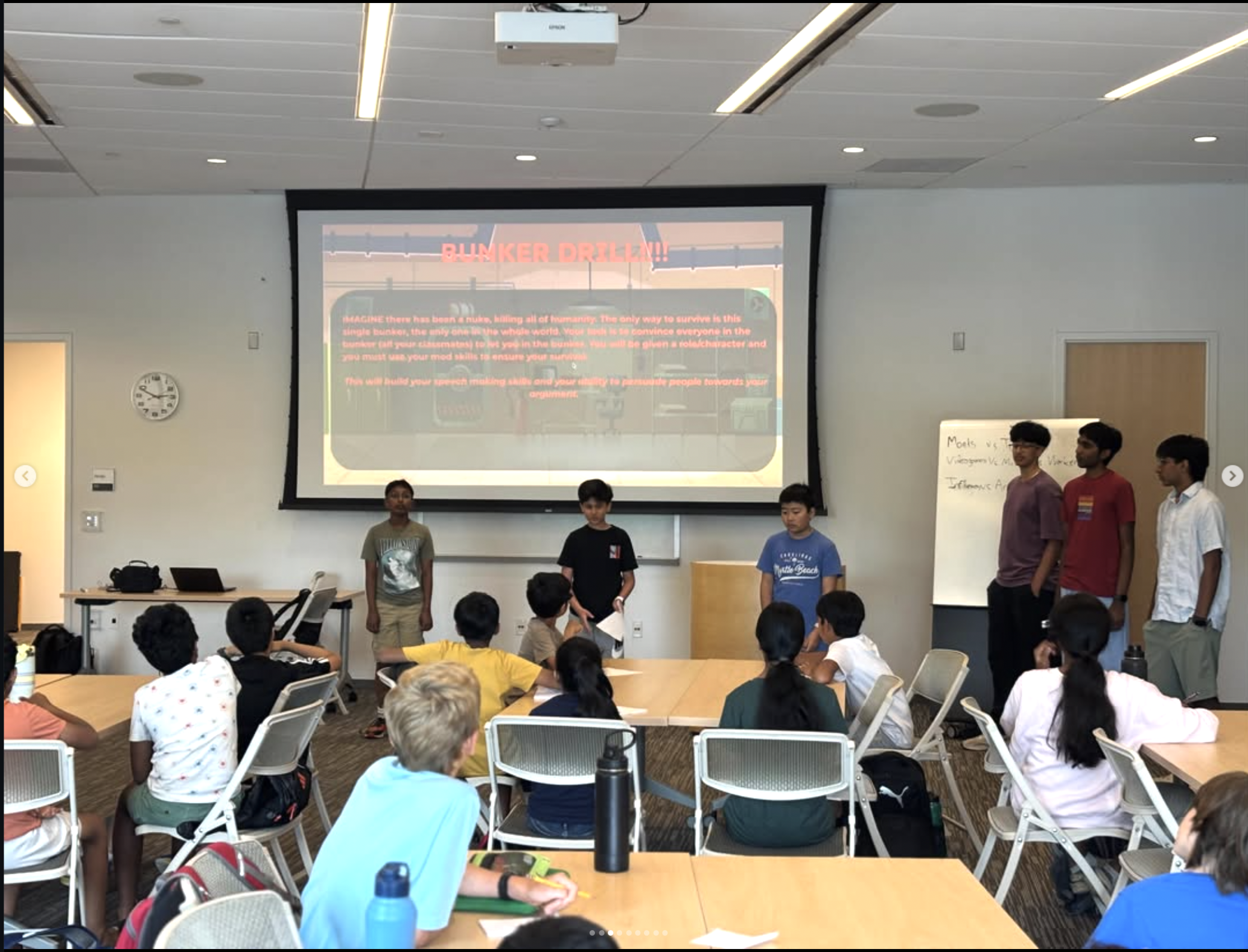 A student practicing a presentation with a coach